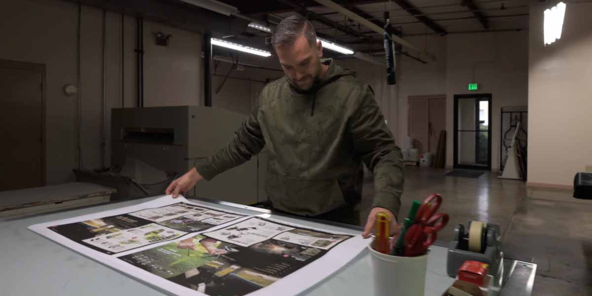 A worker checks a press sheet at Keefer Printing A worker checks a press sheet at Keefer Printing